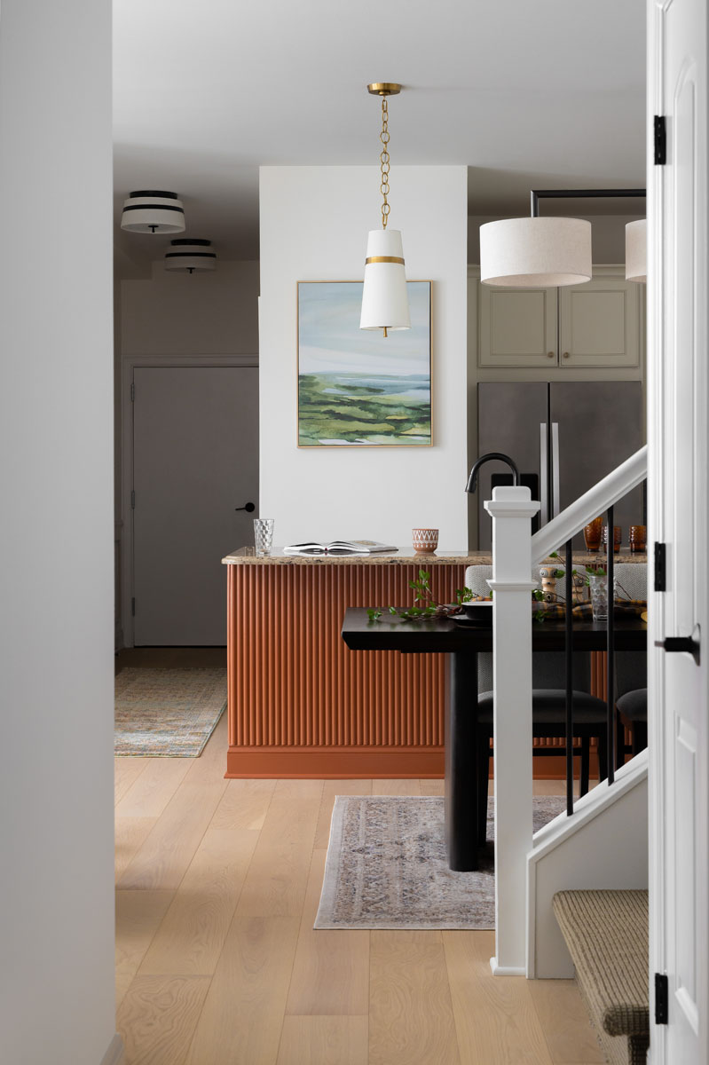 Modern open-concept home in Ann Arbor, MI, featuring a luxury kitchen and dining area with custom finishes.