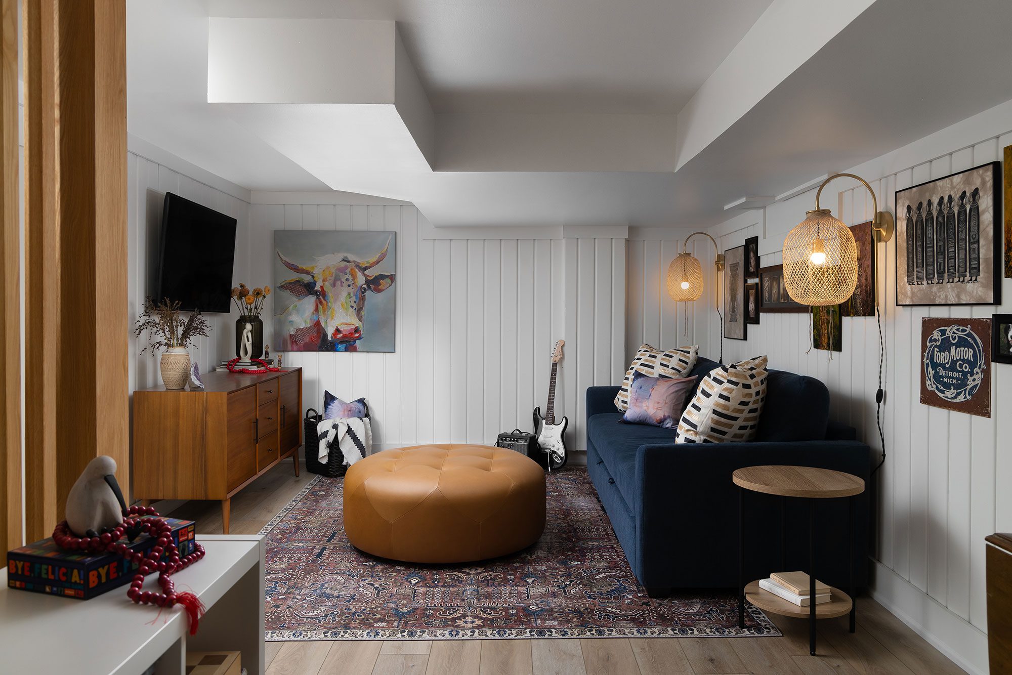 Residential interior design by Clark + Aldine – a stylish basement hangout showcasing high-end remodeling and custom-built functionality.