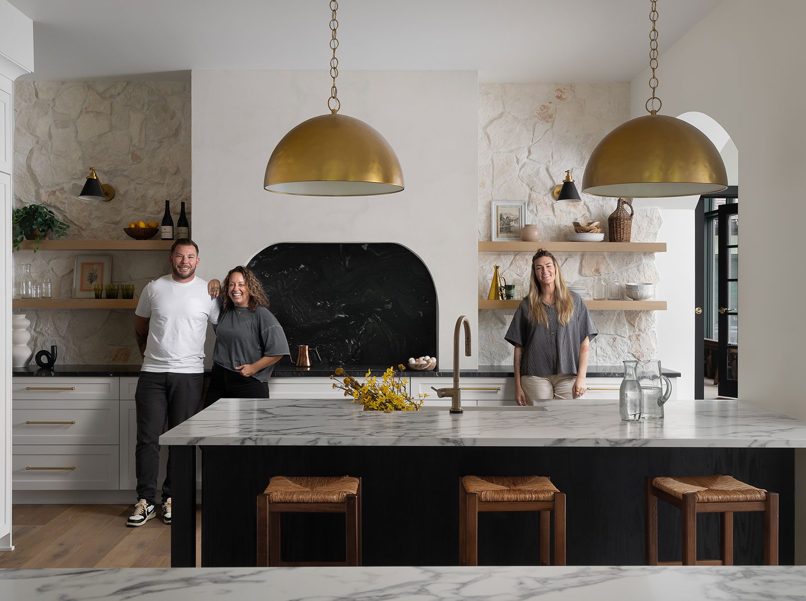 Construction and remodeling by Clark + Aldine – the team collaborating in a modern kitchen to kick off a custom design project.