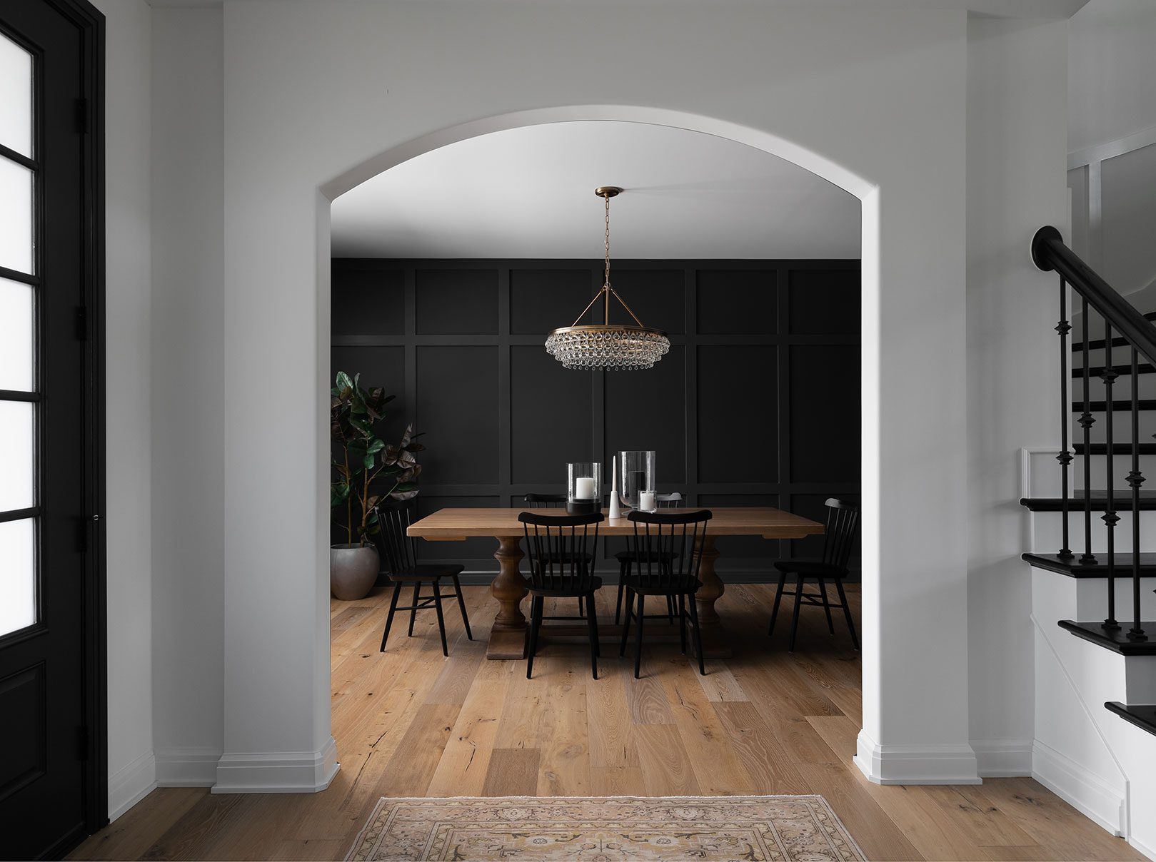 Construction and remodeling by Clark + Aldine – a modern hallway leading into a dining room, showcasing final punch-out detailing before project completion.