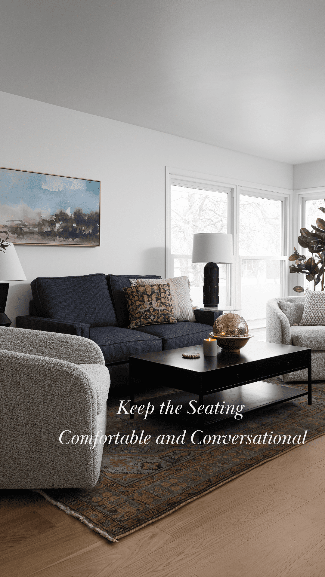 A biophilic living room with comfortable seating arranged for conversation, featuring a mix of textures, warm lighting, and natural decor elements to enhance connection.